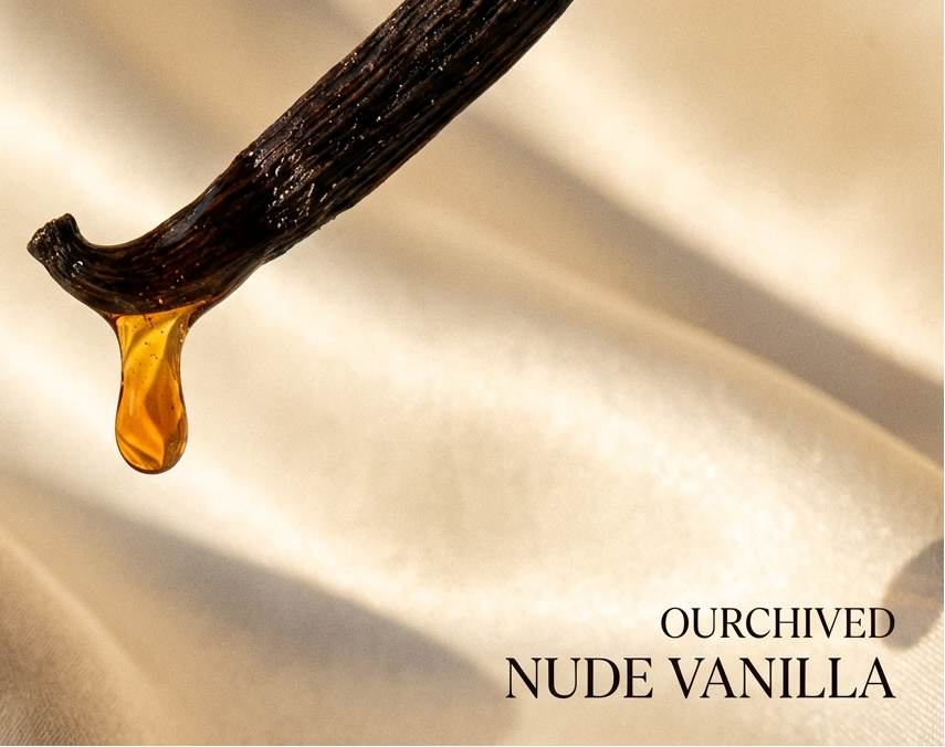 Vanilla pod with a drop of vanilla extract on a soft beige background