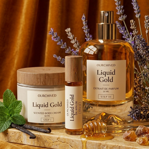 Ourchived Liquid Gold skincare and fragrance products on a wooden surface with lavender and honeycomb.